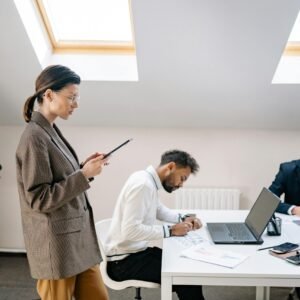 A diverse group of professionals working together in a bright, modern office space.