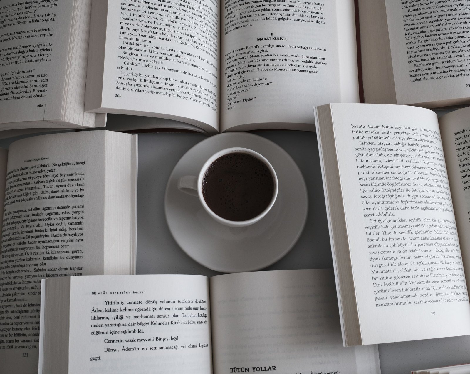 Relaxing setup with open books and a coffee cup, perfect for a serene reading session.